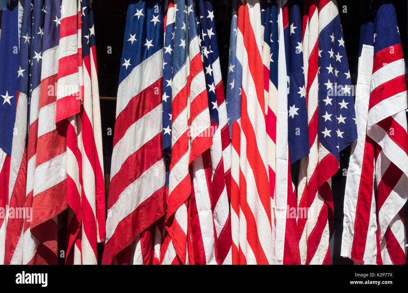 Pre-owned American flags for sale in an antique shop window in the Nollta district of Lower ManhattanAmerica Stock Photo