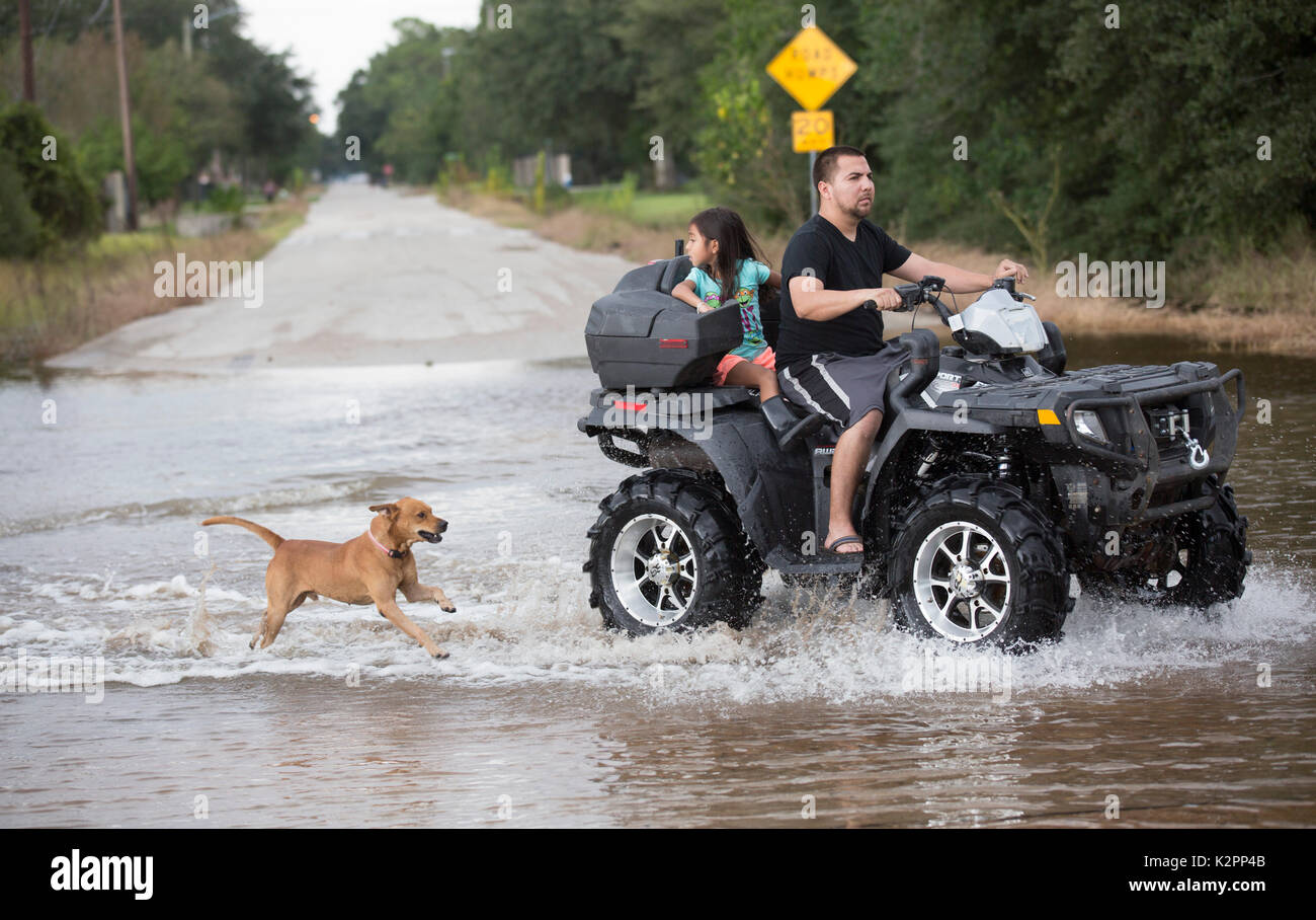 Houston, United States. 30th Aug, 2017. Residents use an ATV to cross floodwaters in the aftermath of Hurricane Harvey August 30, 2017 in Houston, Texas. Credit: Planetpix/Alamy Live News Stock Photo