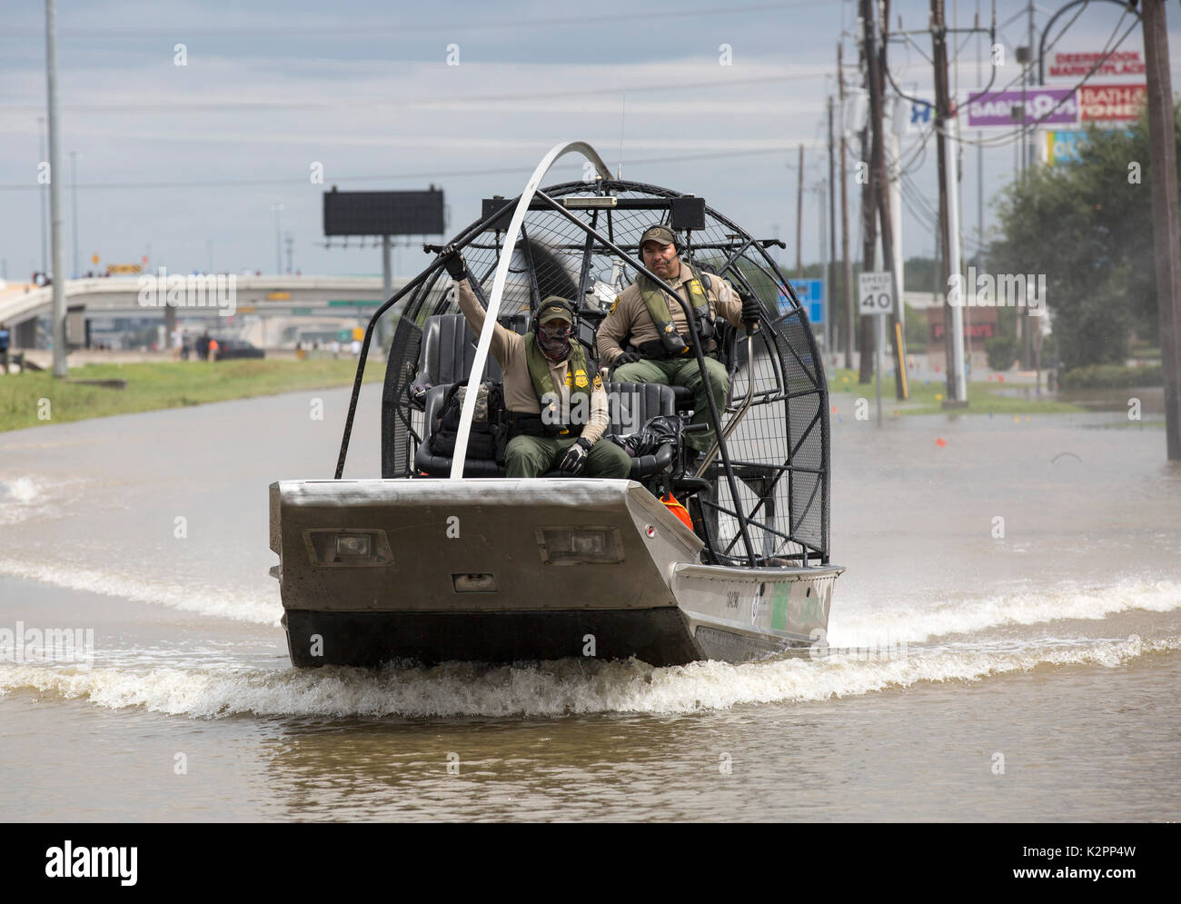 Houston, United States. 30th Aug, 2017. U.S Border Patrol riverine agents on an air boat patrol a neighborhood flooded by rising waters to assist in evacuating resident in the aftermath of Hurricane Harvey August 30, 2017 in Houston, Texas. Credit: Planetpix/Alamy Live News Stock Photo