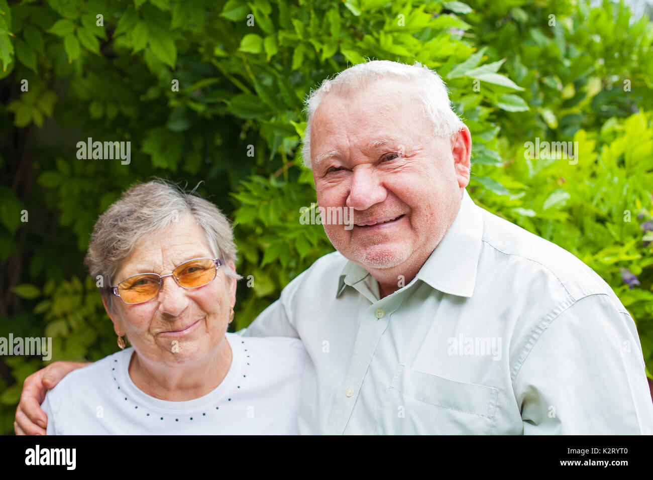 Happy senior couple in love posing in the park outdoor Stock Photo - Alamy