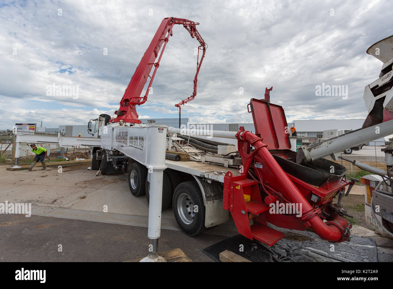 Pumping concrete at construction site. Stock Photo