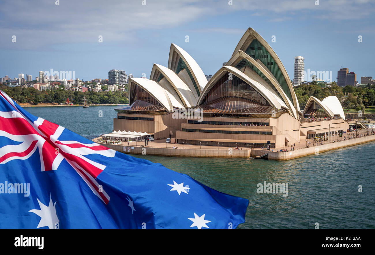 Australian flag flying in front of Sydney Opera House. Composite image. Stock Photo