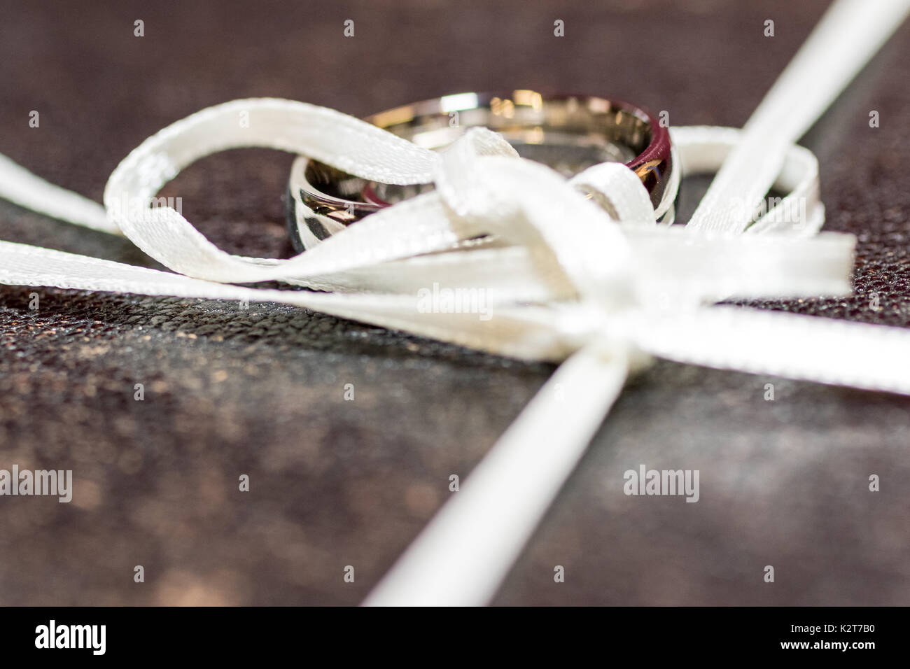 Wedding day images showing love and affection on this special day. A loving couple enjoying flowers, cakes, and celebrating the marriage. Stock Photo