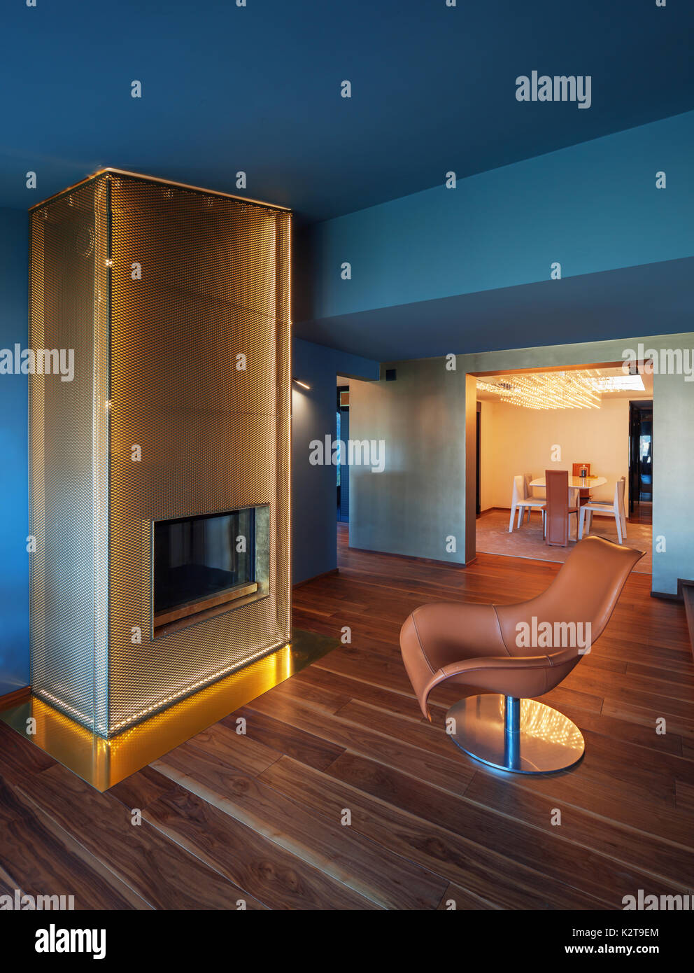 Modern livingroom with gold fireplace Stock Photo Alamy