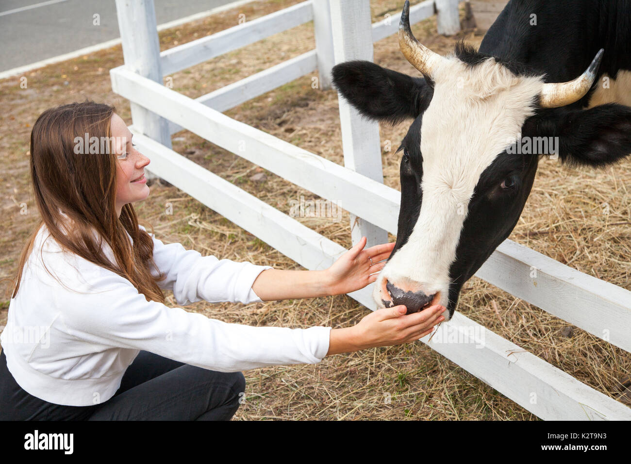 Portrait of woman working in barn. Smiling farmer woman standing by ...