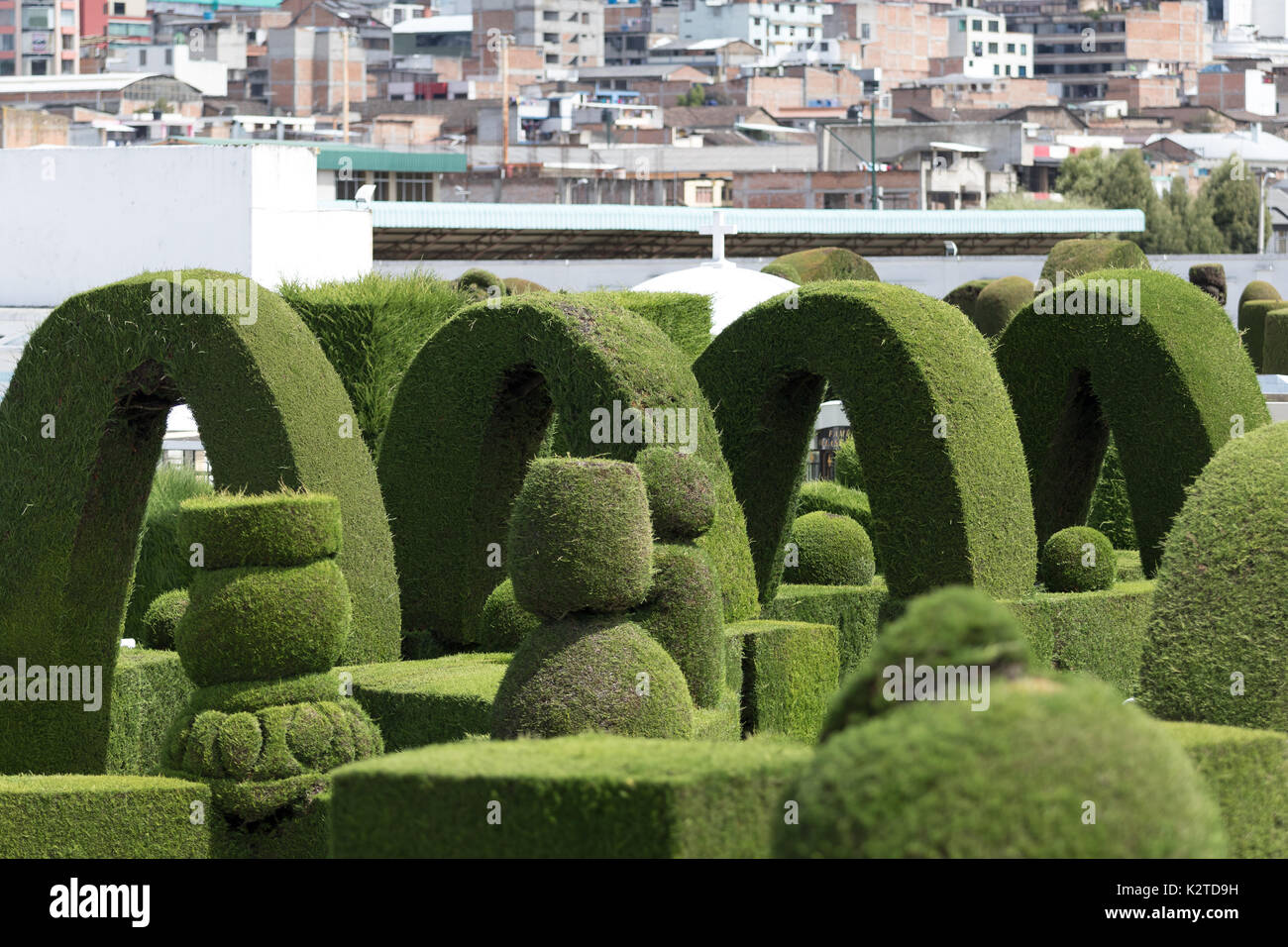 May 16, 2017 Tulcan, Ecuador: green arches in the extensive topiary of the local cemetery Stock Photo