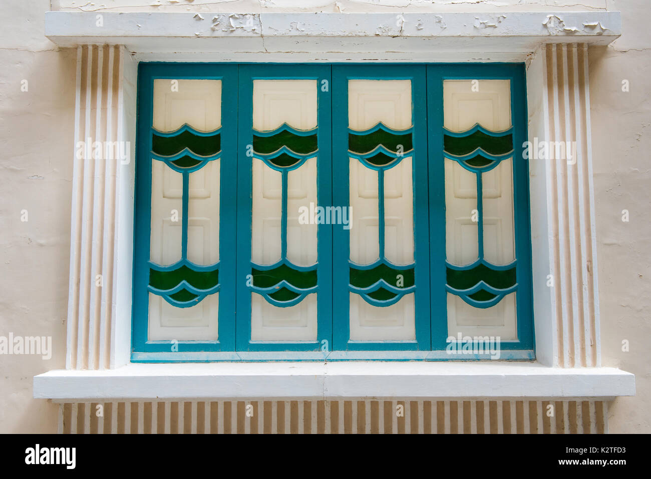 Blue wooden window in a stone house. Valetta, Malta Stock Photo