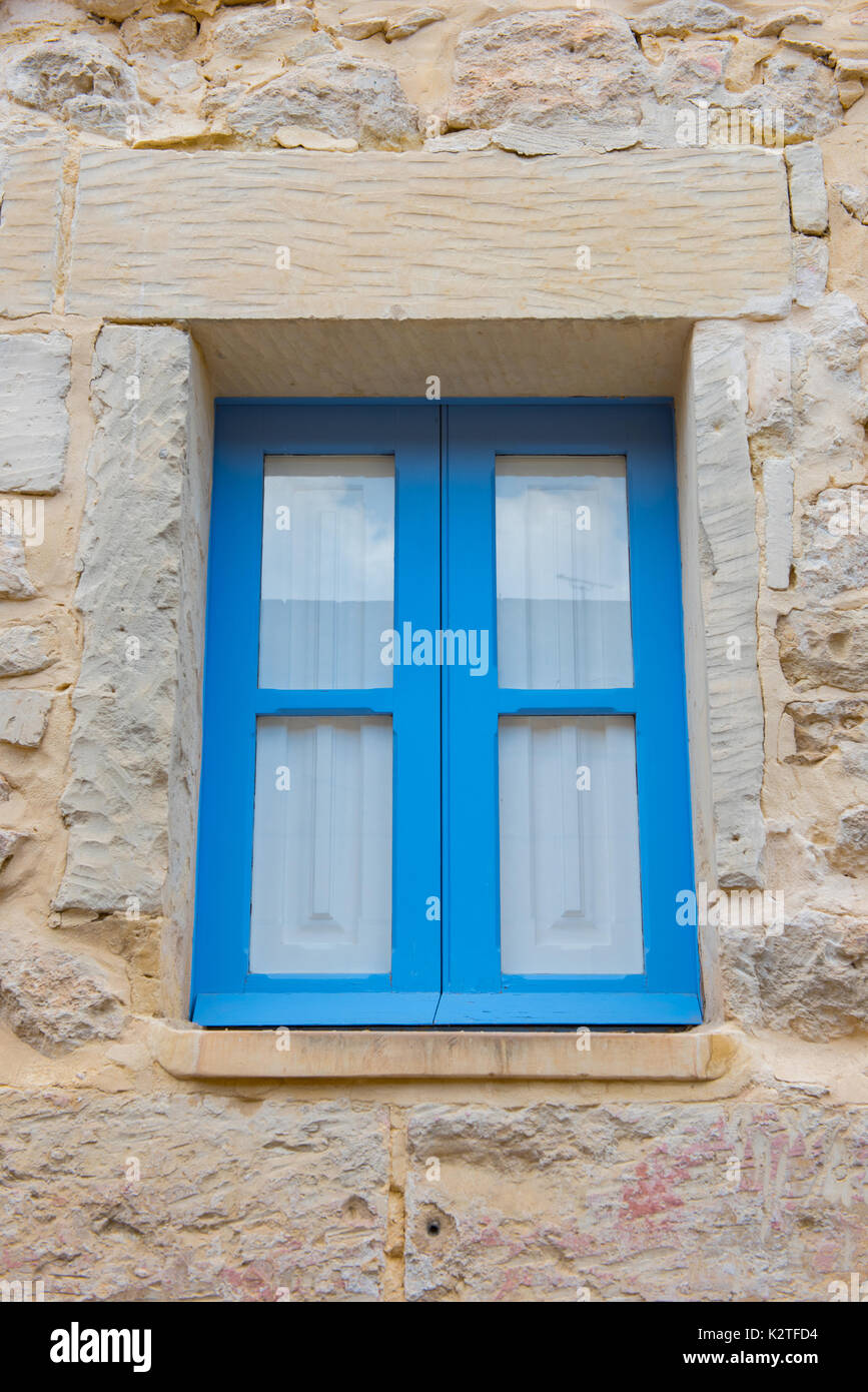 Blue wooden window in a stone house. Mdina, Malta Stock Photo