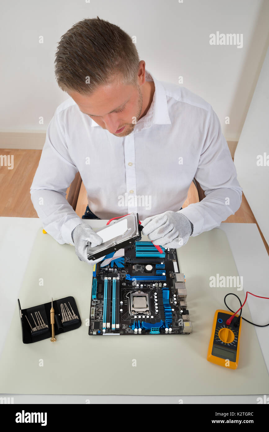 Man Fixing Computer Hardware High Resolution Stock Photography and ...