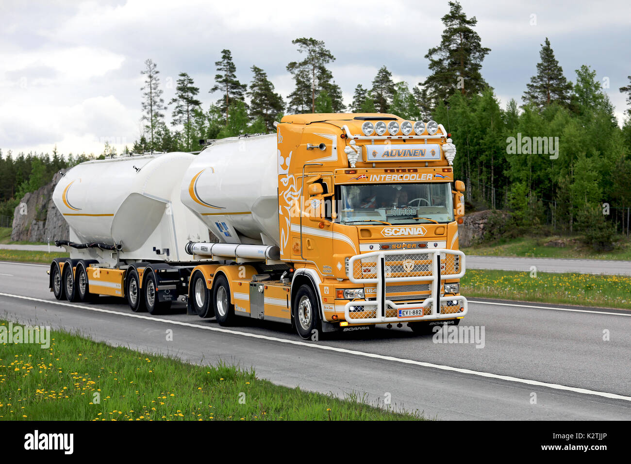 PAIMIO, FINLAND - JUNE 9, 2017: Super tank truck Scania R164 of Kuljetus Auvinen Oy on the road on a cloudy summer afternoon in South of Finland. Stock Photo