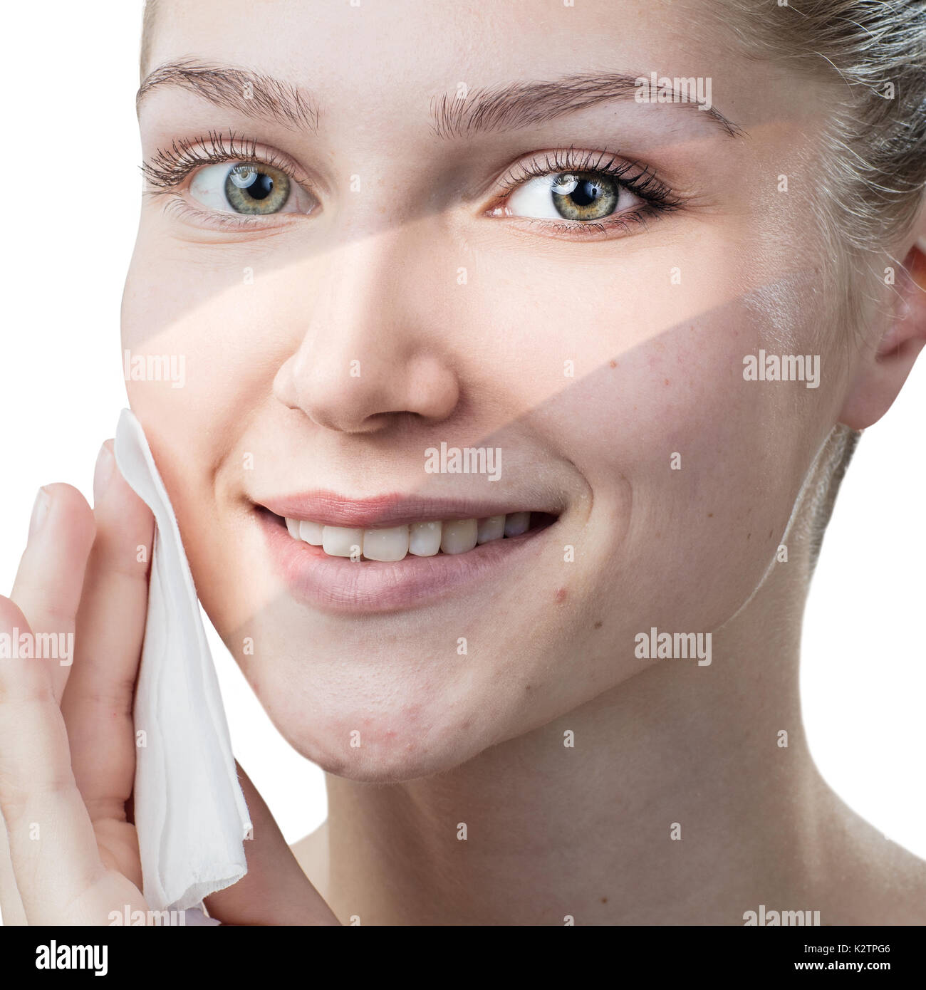 Young woman cleaning her face by napkins. Stock Photo