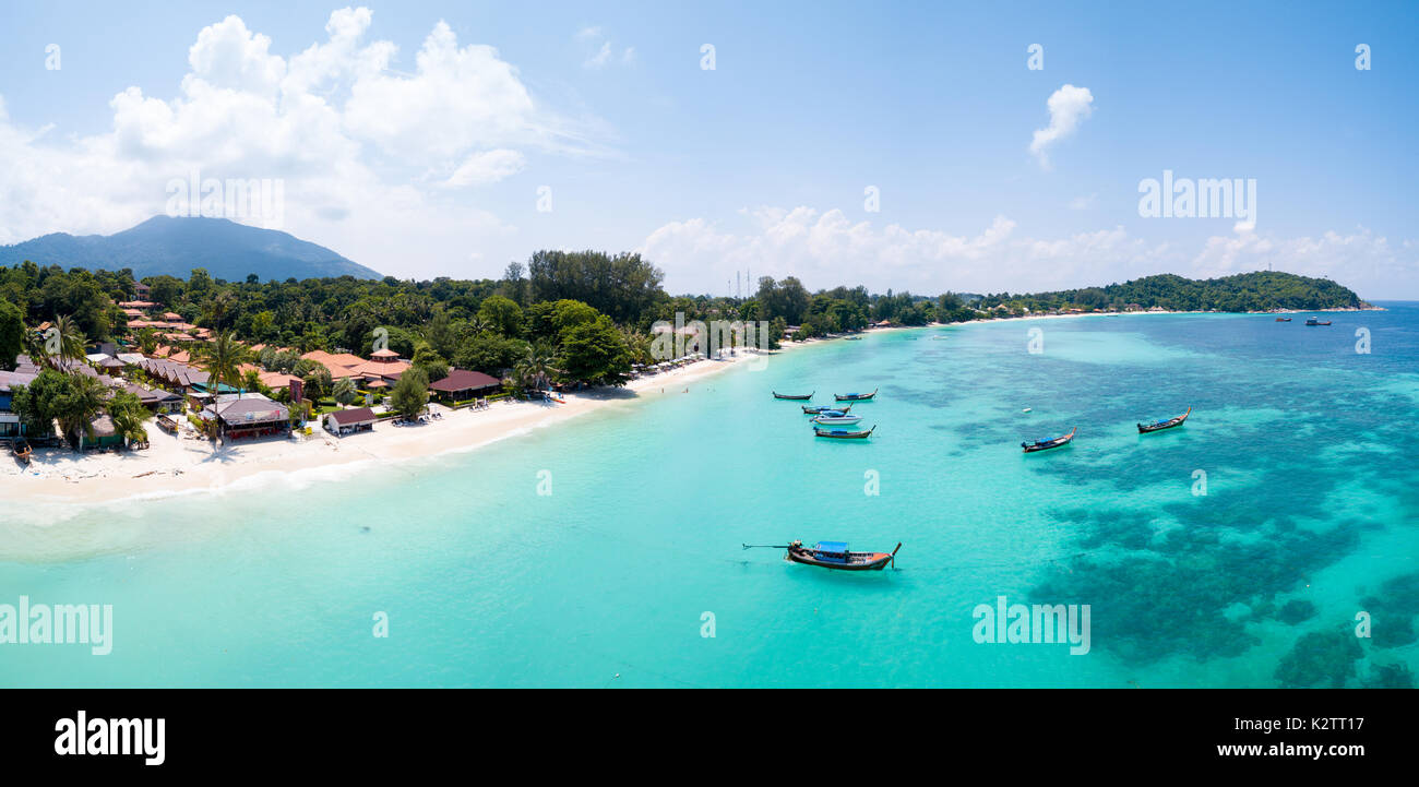 Aerial panoramic view of Pattaya Beach over crystal clear tropical water on island paradise Ko Lipe, Thailand Stock Photo