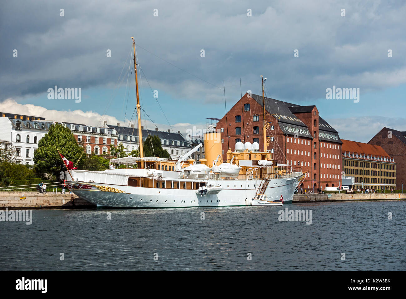 Royal Danish Yacht (Kongeskibet) Dannebrog moored at the quay at Larsens Plads beside Amalienborg Palace in the harbour of Copenhagen Denmark Europe Stock Photo