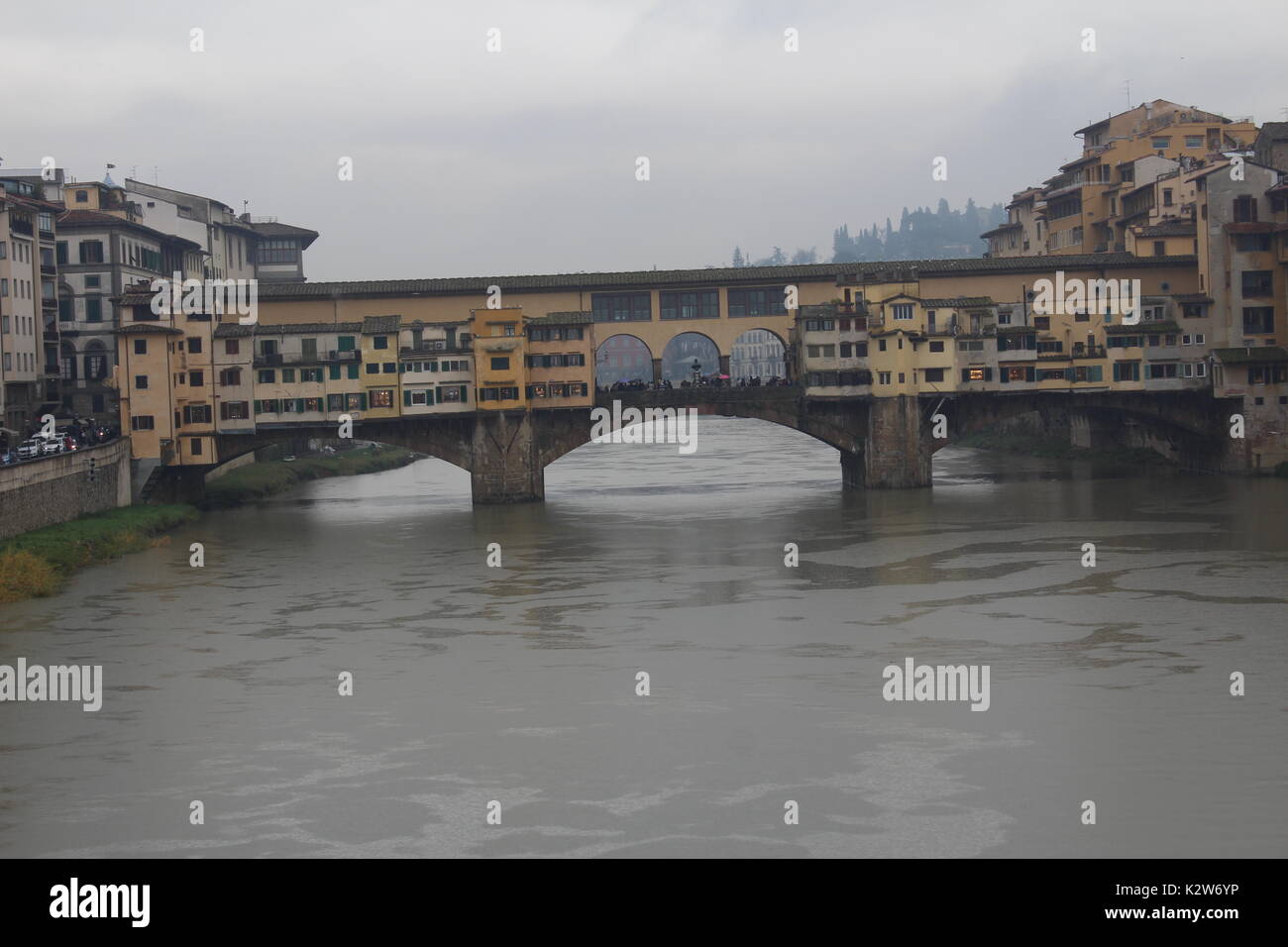 Old Bridge, medieval stone closed-spandrel segmental arch bridge over the Arno River, in Florence Stock Photo