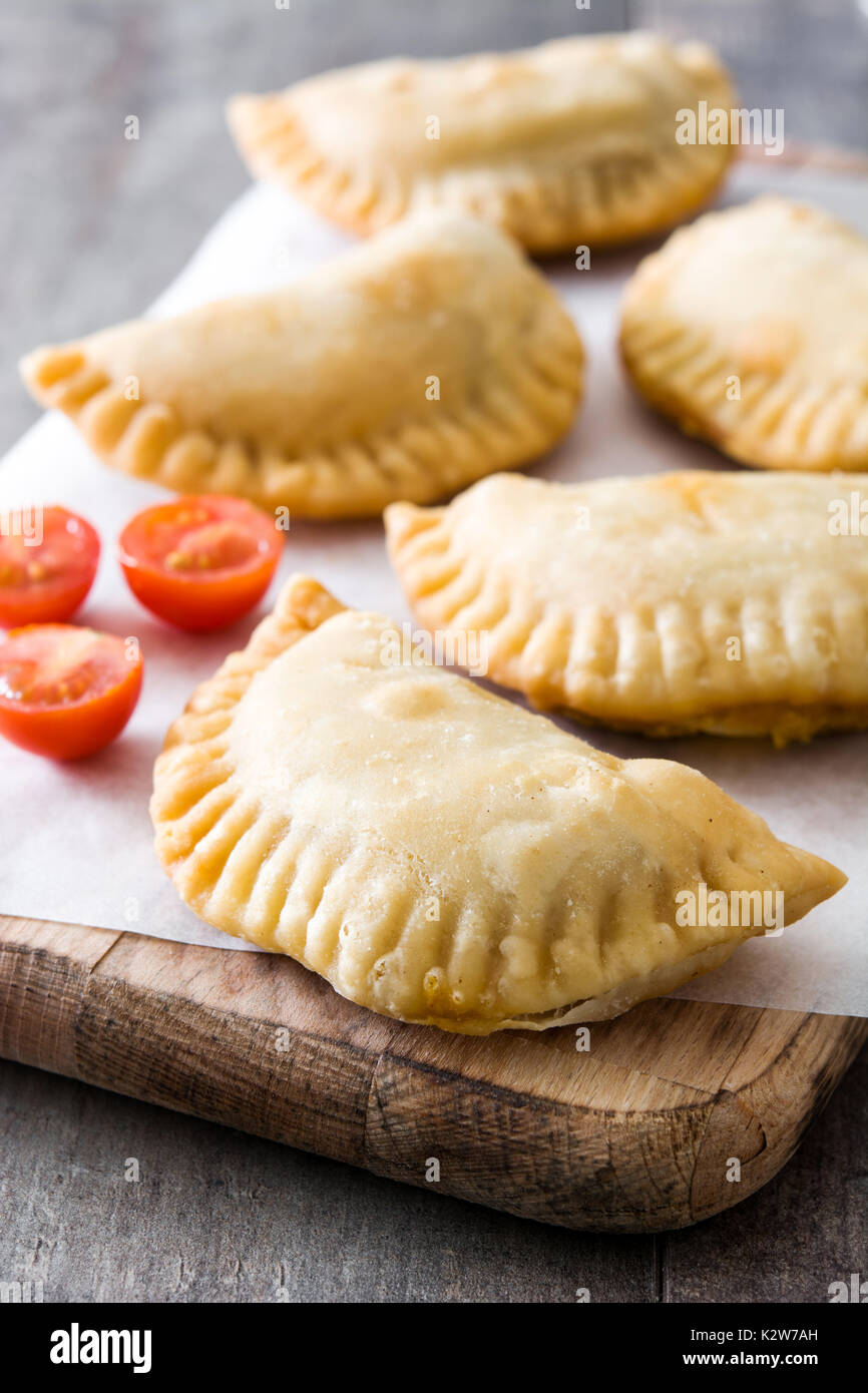 Typical Spanish empanadas on wooden table Stock Photo Alamy
