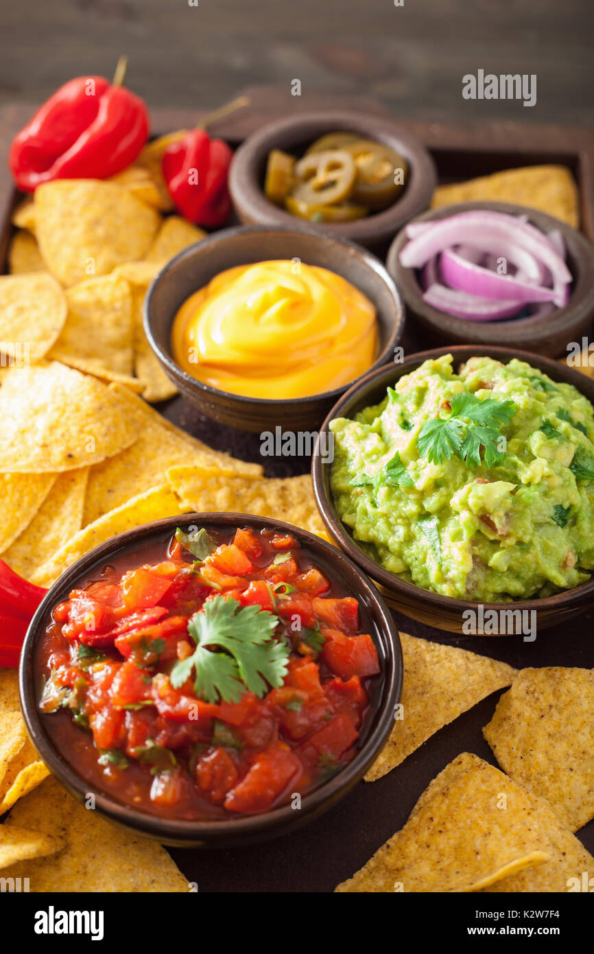 mexican nachos with guacamole, salsa and cheese dip Stock Photo Alamy