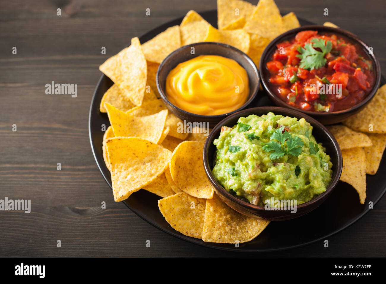 mexican nachos with guacamole, salsa and cheese dip Stock Photo Alamy