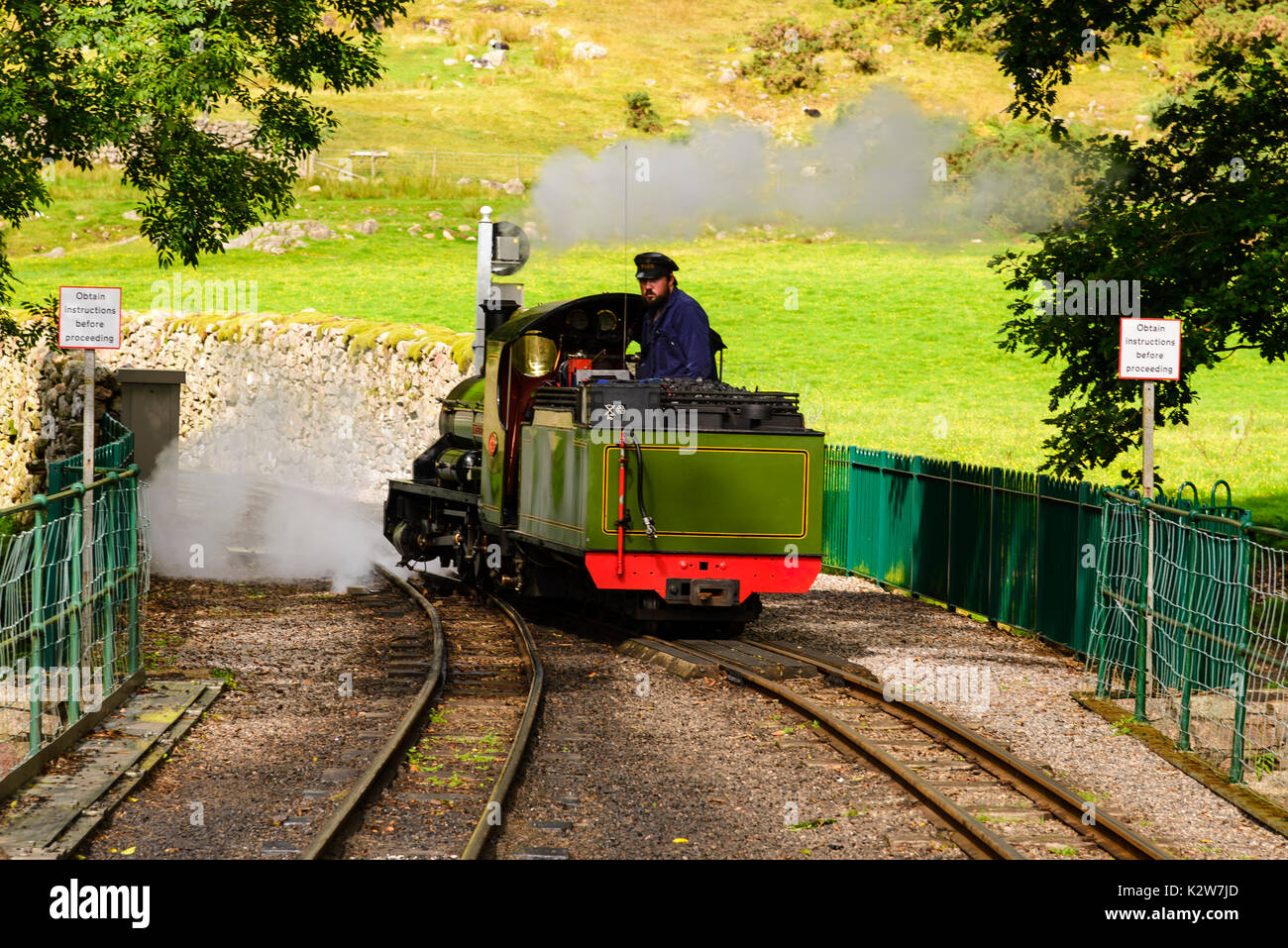 Engine driver and steam locomotive at Dalegarth station on the Ravensglass & Eskdale Railway Stock Photo