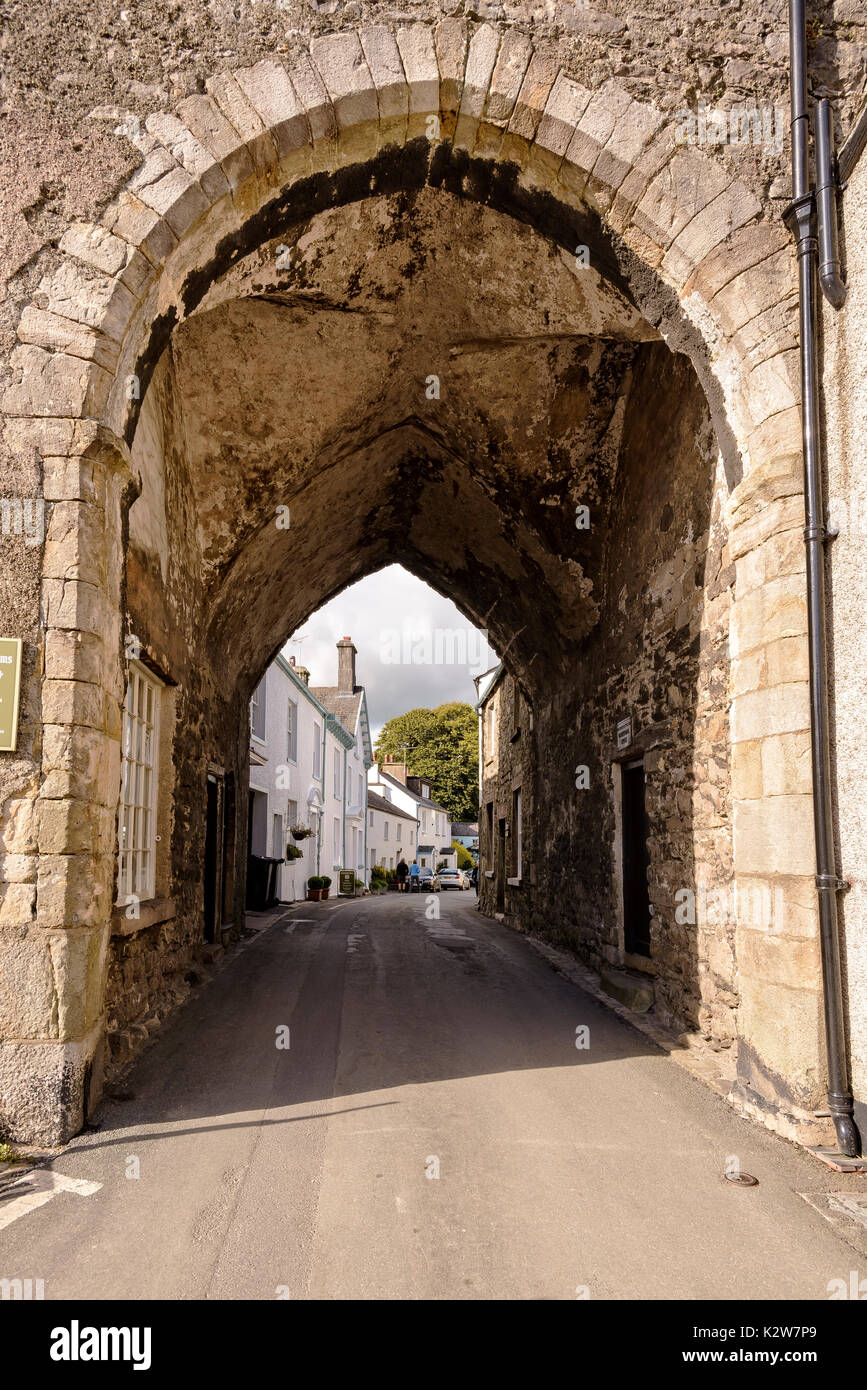 View through lovely stone arch to old streets in Cartmel Stock Photo