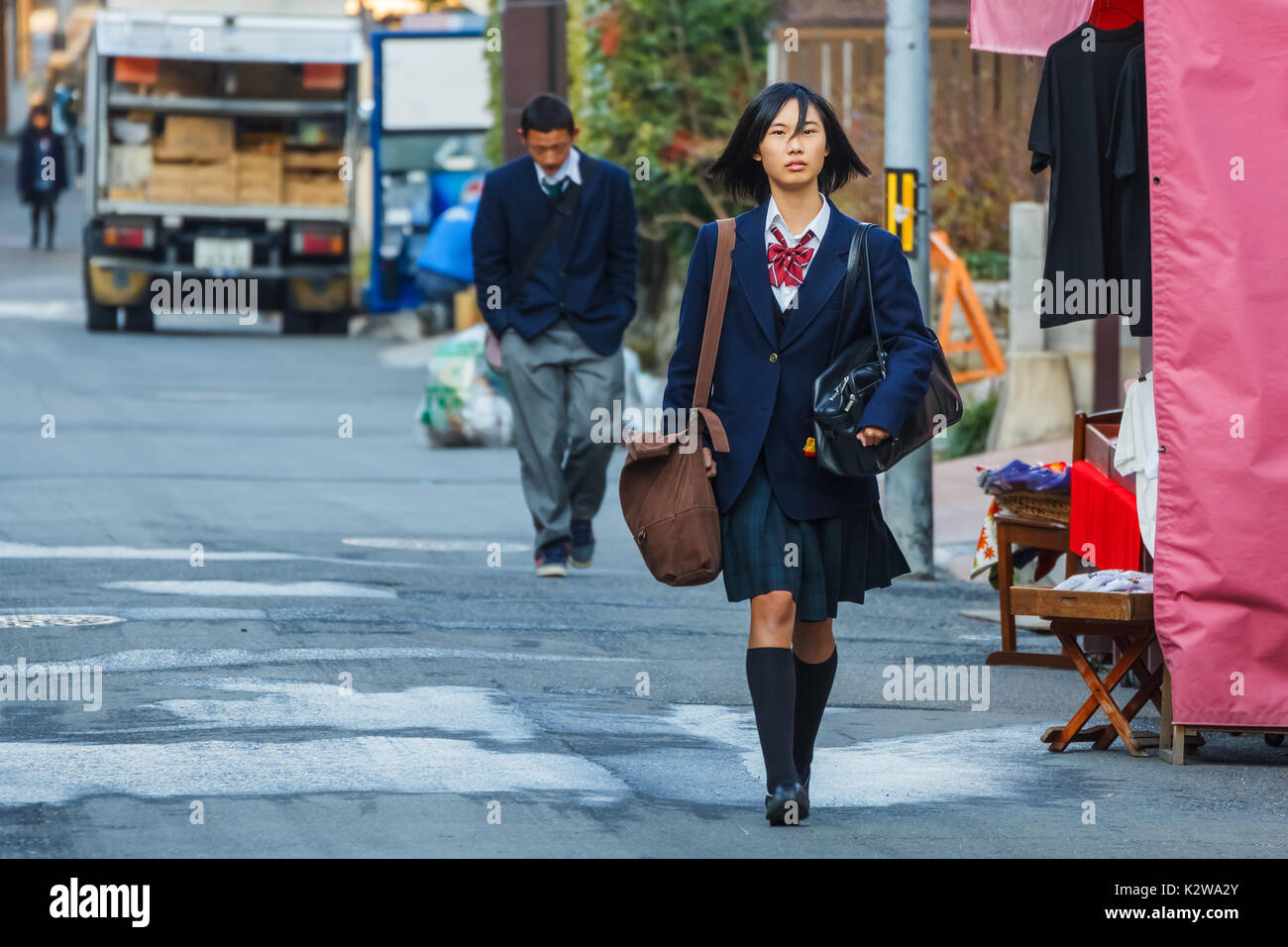 KYOTO, JAPAN - NOVEMBER 20: Japanese Student in Kyoto, Japan on November 20, 2013. Unidentified female Japanese student travels to school in the morni Stock Photo