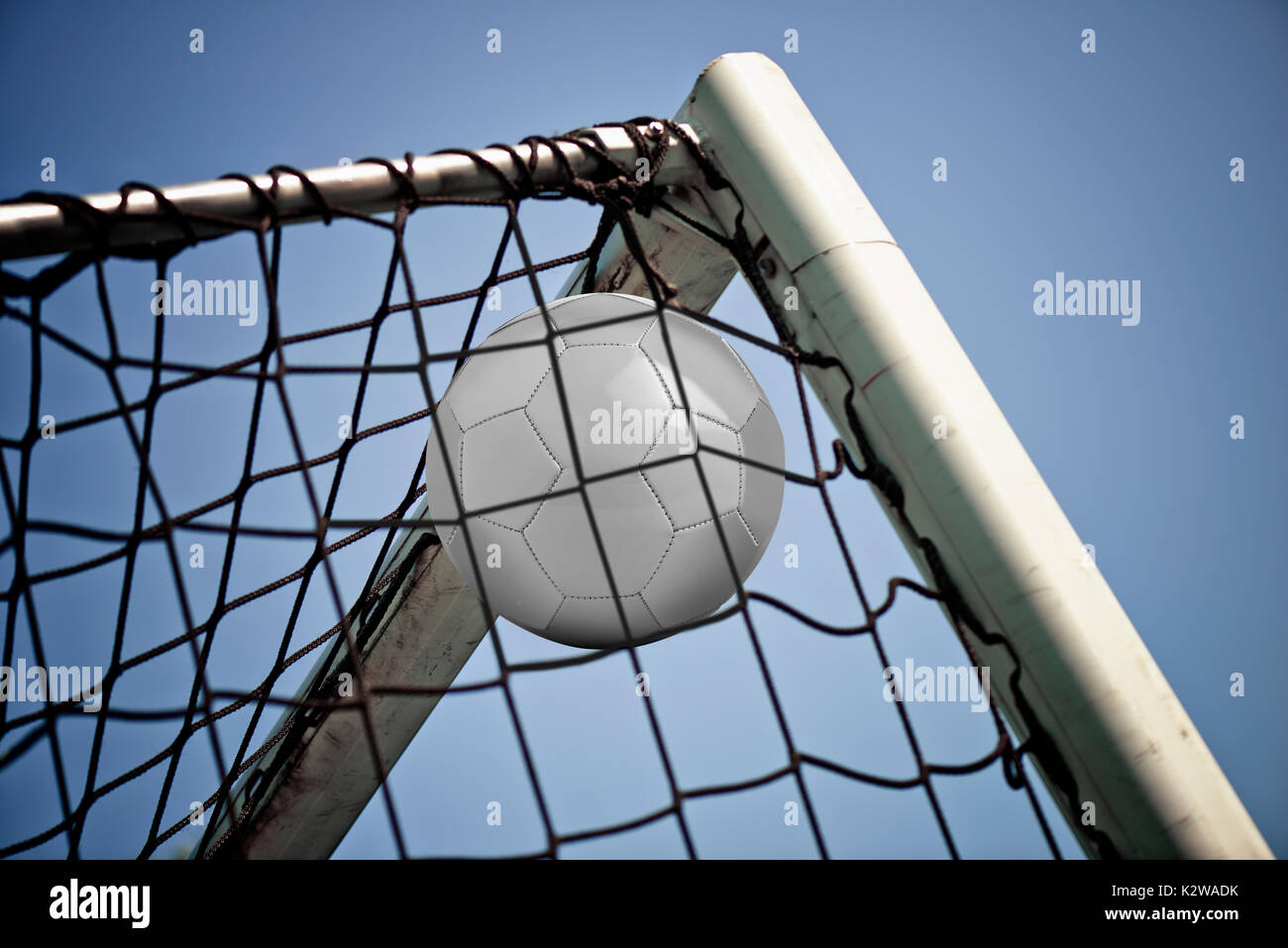 Soccerball in net ready for championship Stock Photo - Alamy