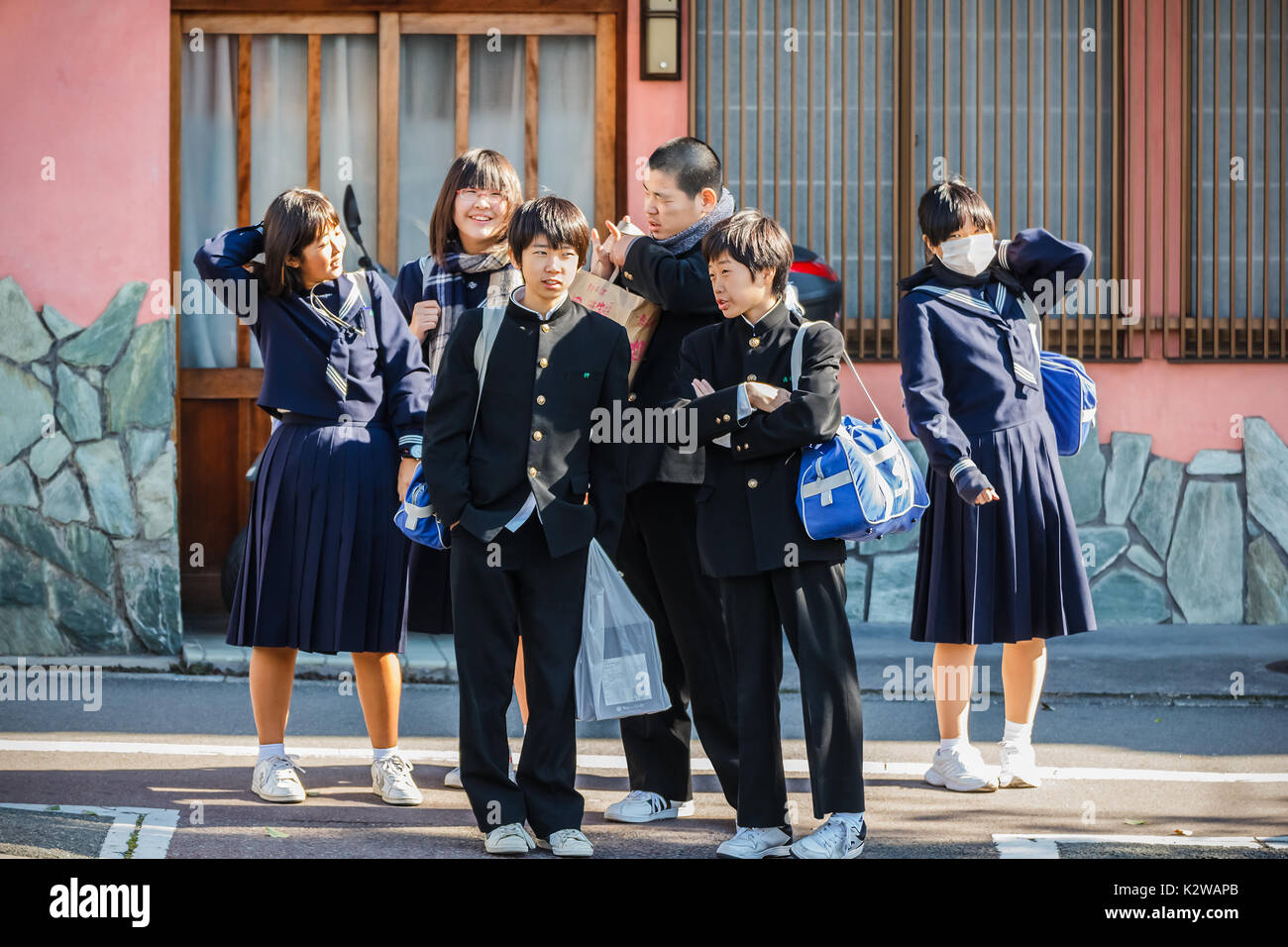 KYOTO, JAPAN - NOVEMBER 20: Japanese Students in Kyoto, Japan on November 20, 2013. Unidentified group of Japanese students are on the way to school Stock Photo