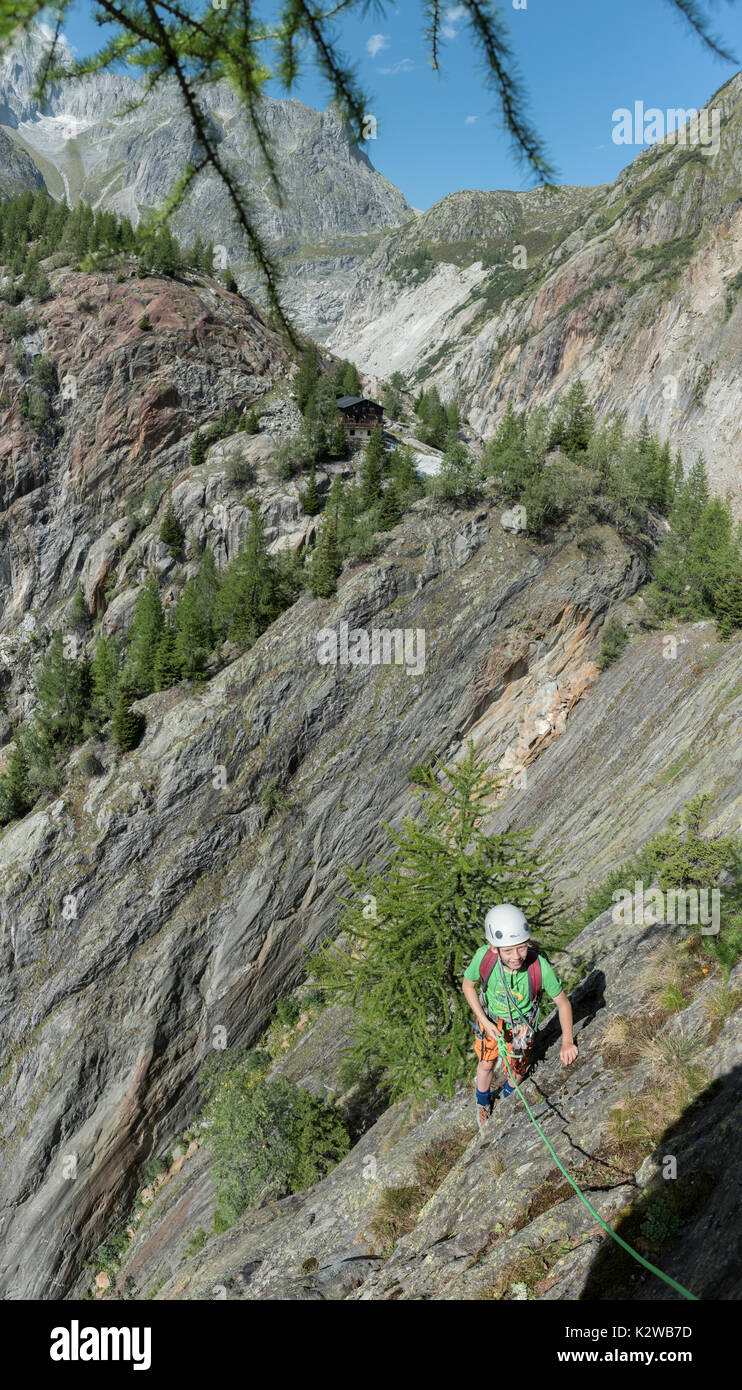 Rock climbing on the slabs at the Burghutte in Fieschertal Stock Photo