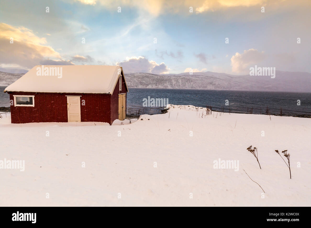 Typical norwegian warm and cozy house located at the lakeside at a