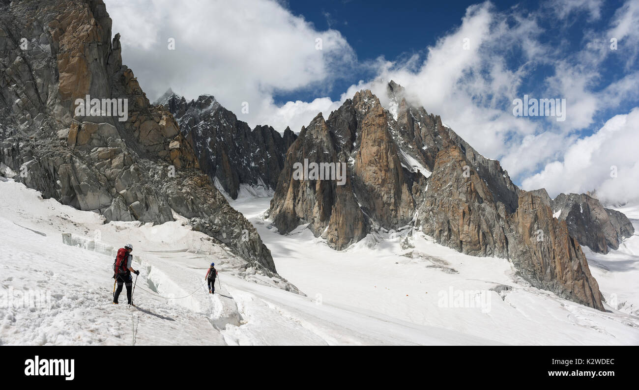 Alpinists on glaciated ground in the Mont Blanc massif Stock Photo