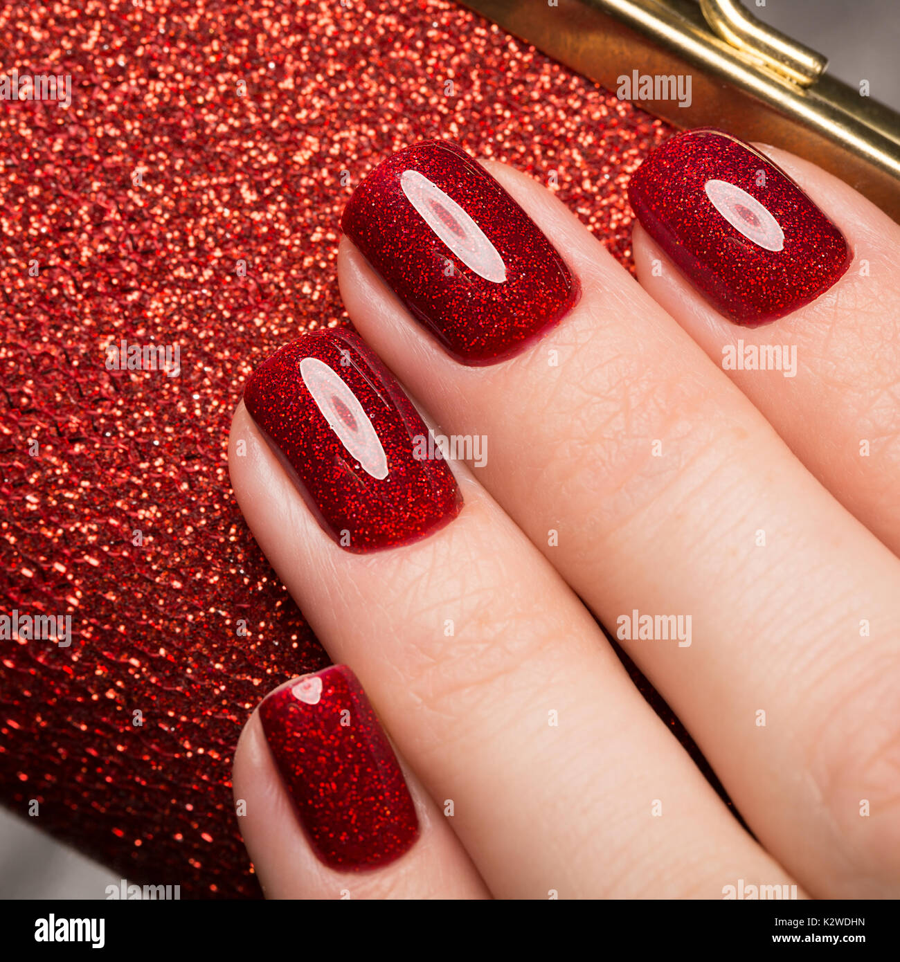 Bright festive red manicure on female hands. Nails design Stock Photo -  Alamy