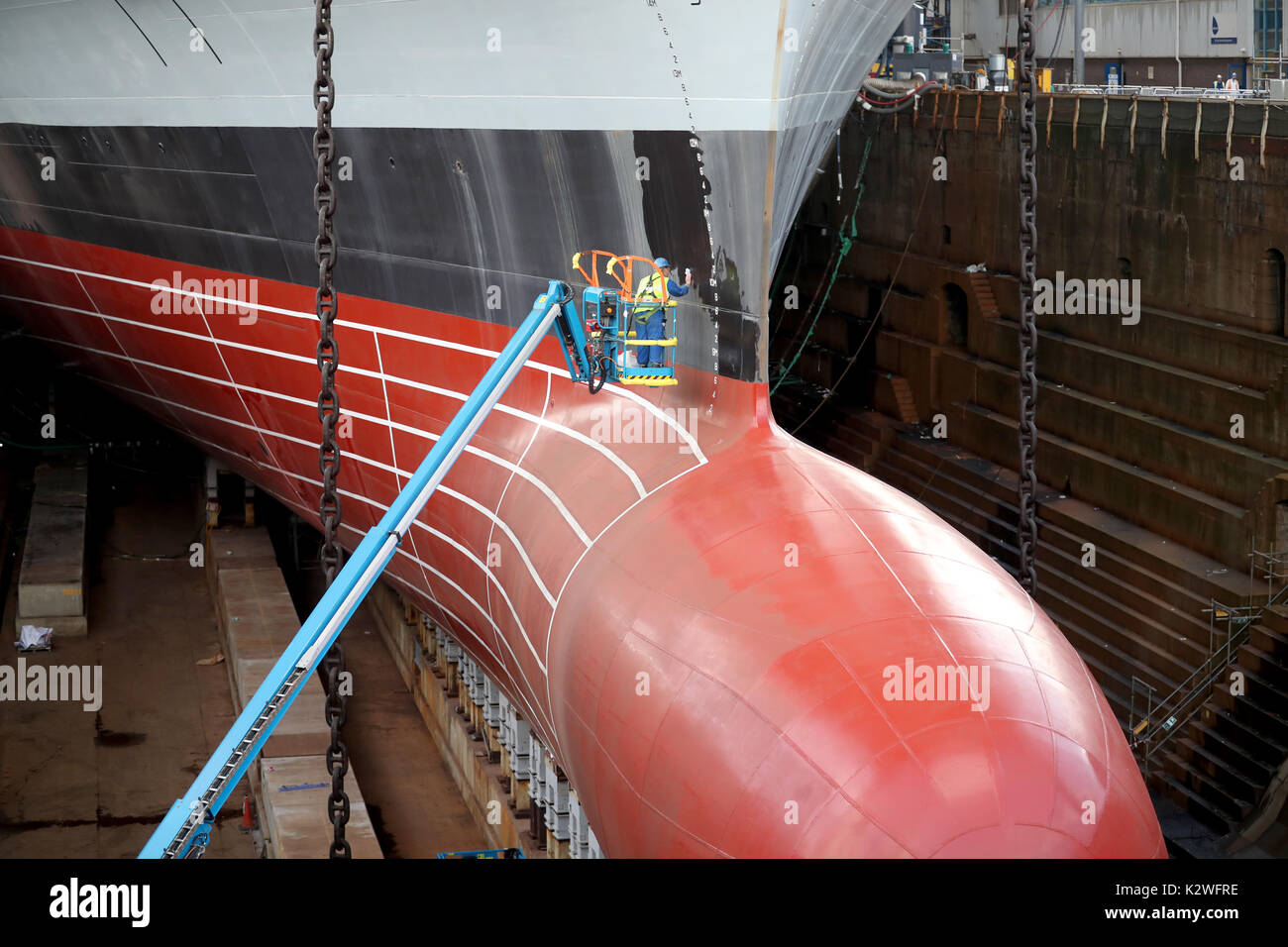 The hull of the HMS Prince of Wales is cleaned as works continue on the