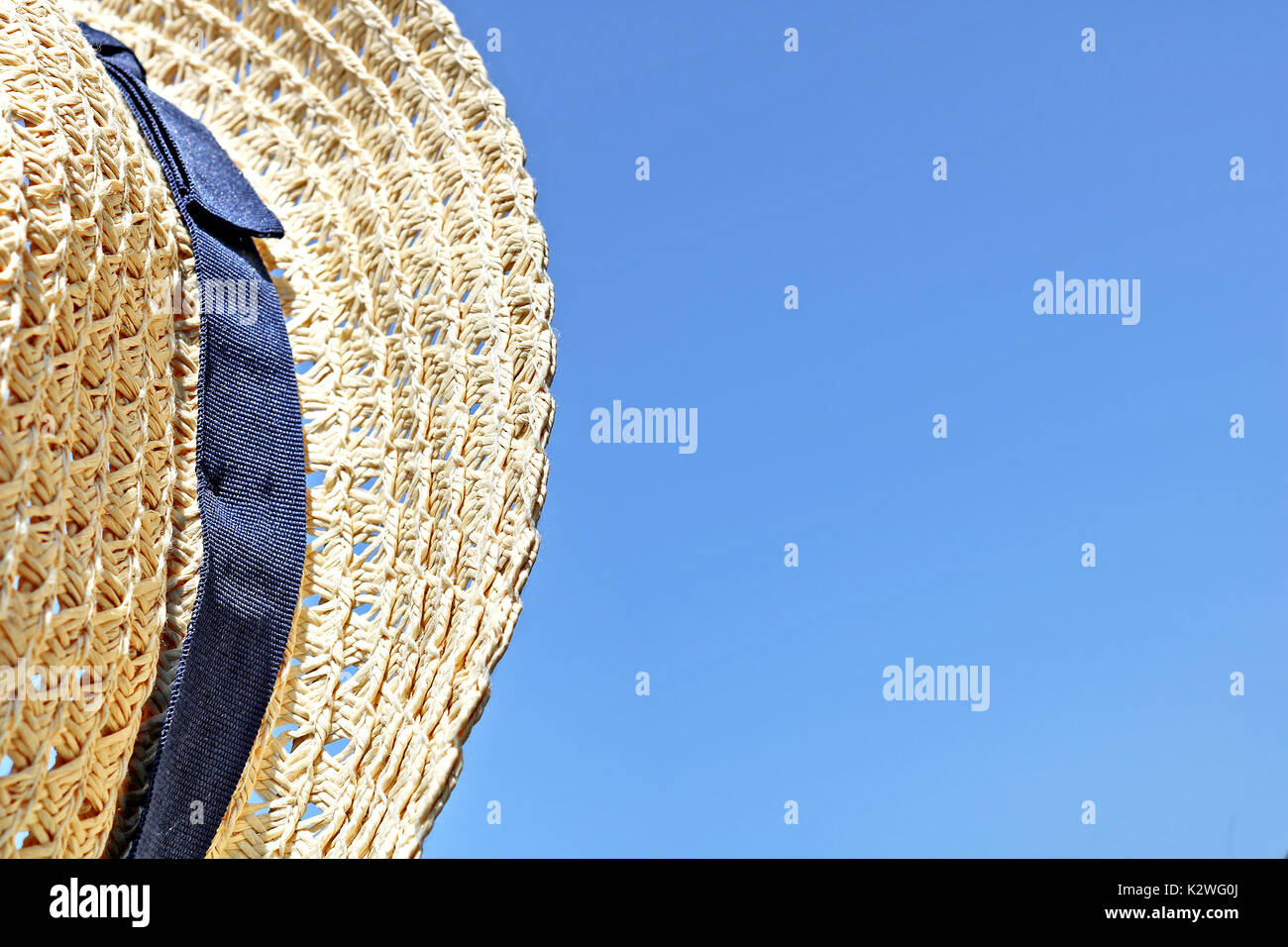 Straw hat on the sky background Stock Photo - Alamy