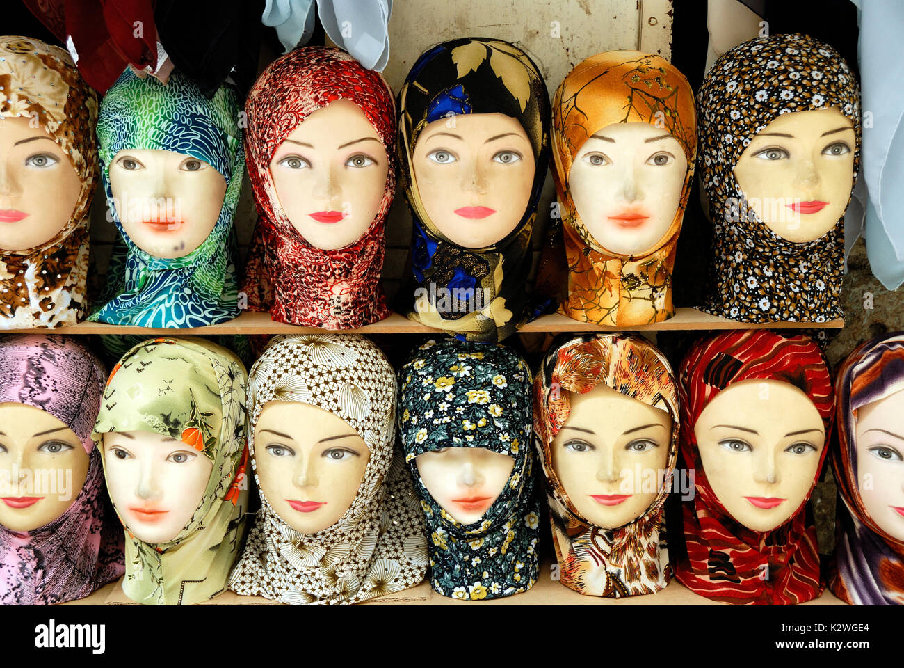 Mannequins with assortment of Muslim headscarfs for sale. Jerusalem, Israel Stock Photo