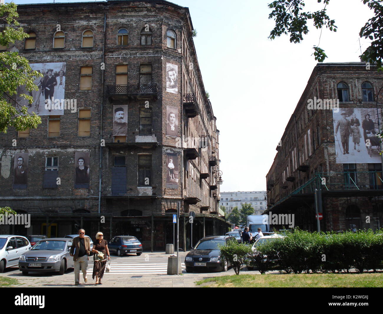 Old houses in Warsaw with photos that recall the memories of the Jews who lived there before the genocide during second world war Stock Photo