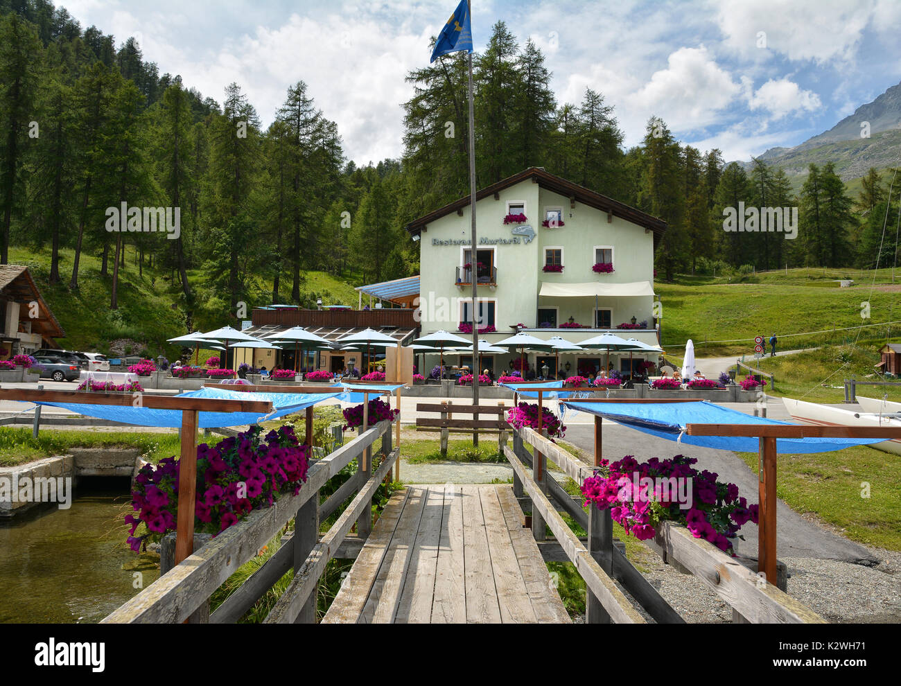 Plaun da Lej, Grisons, Switzerland - JULY 27, 2017. Restaurant Murtarol on the shore of the Sils Lake, near Saint Morits, Switzerland. Stock Photo