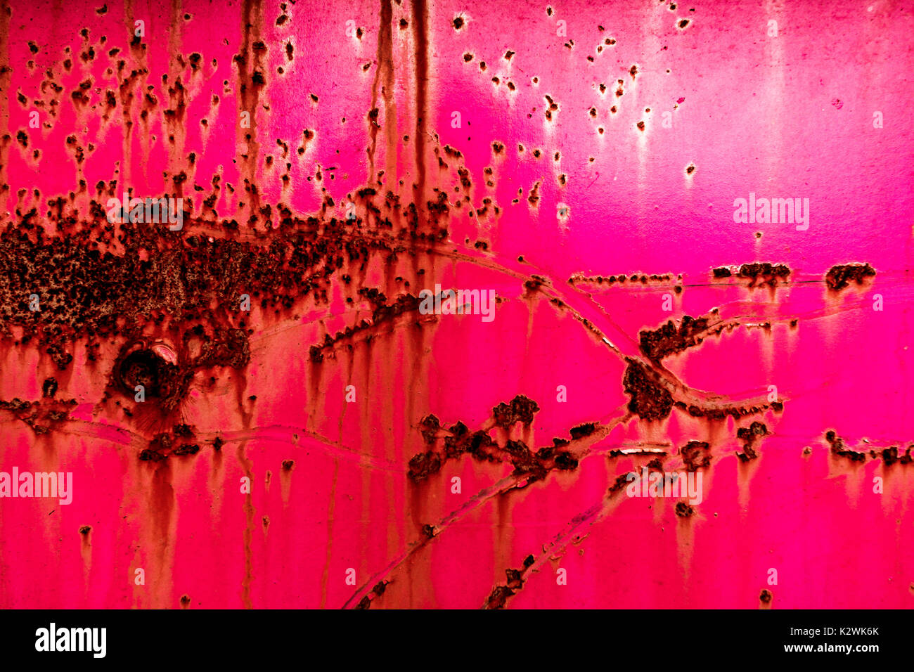 Abstract of rusted metal painted hot pink Stock Photo