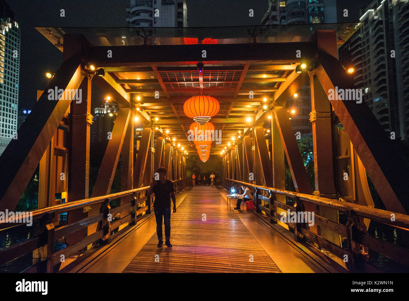 old chinese bridge ilkuminated at night with chinese lanterns, famous hangzhou Stock Photo