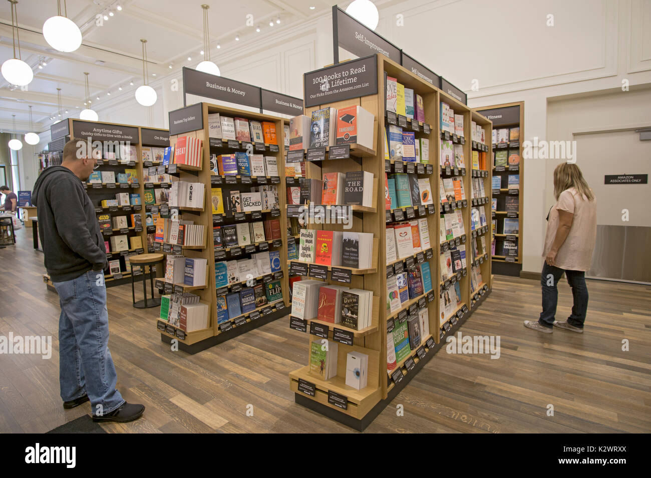 Customers browsing the shelves at the recently opened Amazon Book Store on W. 34th Street in Manhattan, a rare Amazon brick & mortar store. Stock Photo