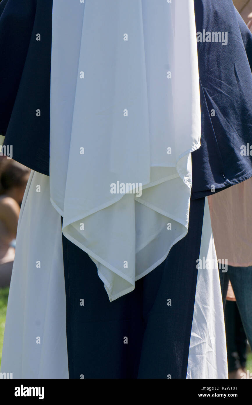 A view from the rear of the habit of a nun from the Sisters of Life order photographed in Washington Square Park in Greenwich Village, New York City. Stock Photo