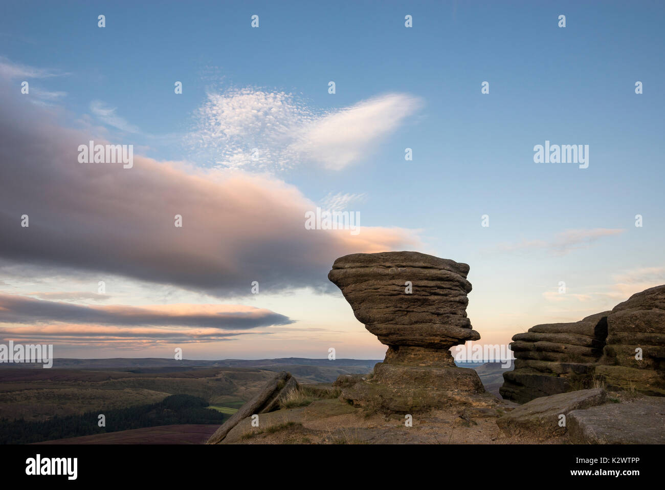 Rock formation at Fairbrook Naze, Peak District on a beautiful summer evening. Derbyshire, England. Flash used to light the foreground. Stock Photo
