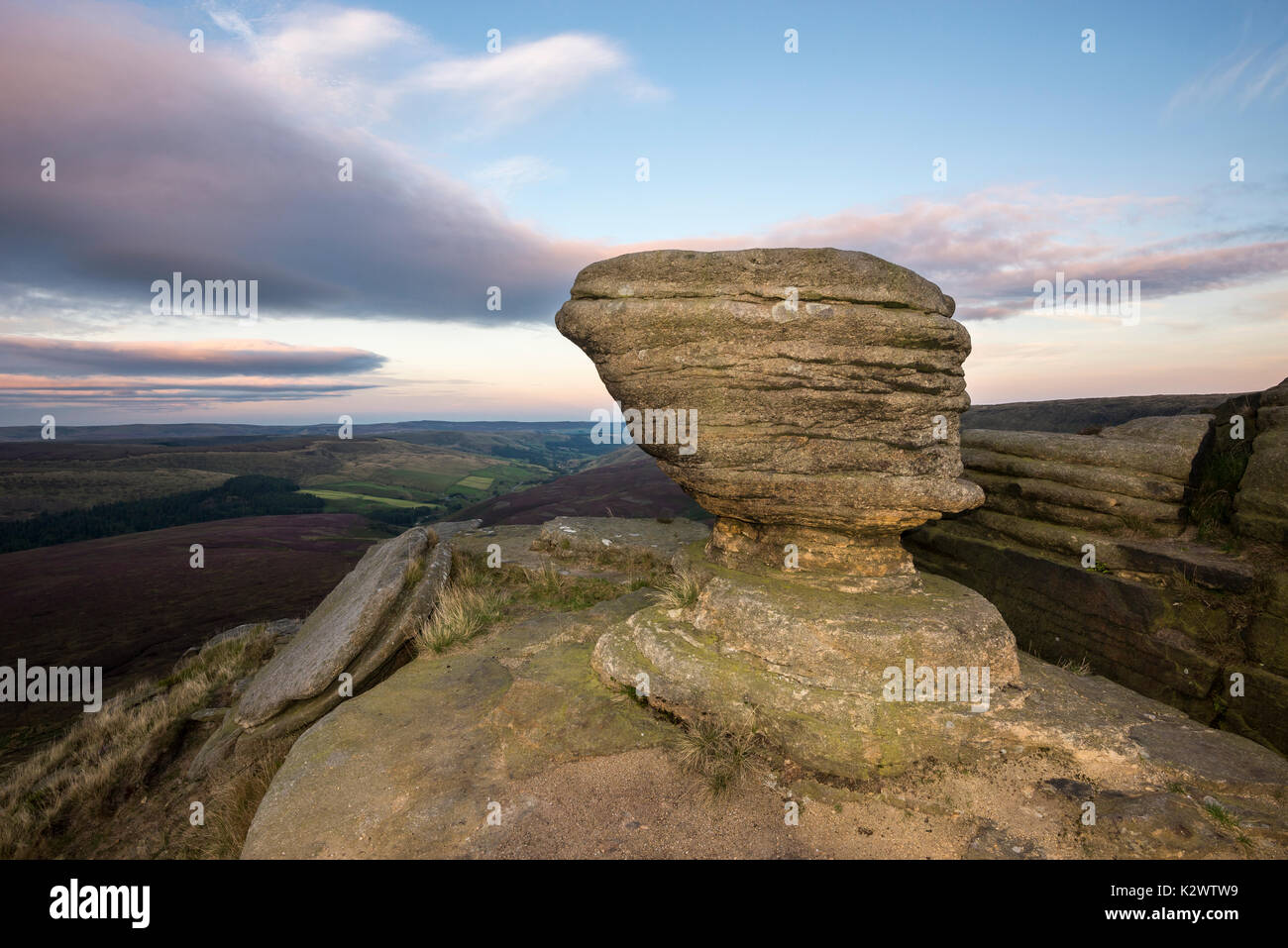 Rock formation at Fairbrook Naze, Peak District on a beautiful summer evening. Derbyshire, England. Flash used to light the foreground. Stock Photo