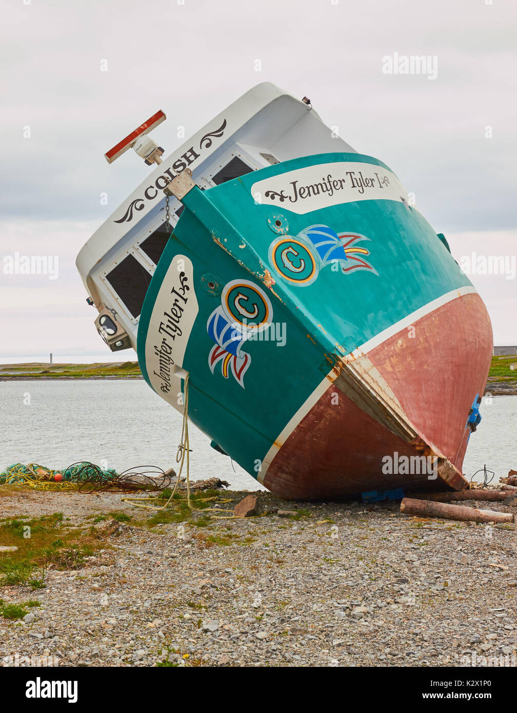 Newfoundland and Labrador flag painted on a rusting fishing trawler, Great Northern Peninsula, Newfoundland, Canada Stock Photo