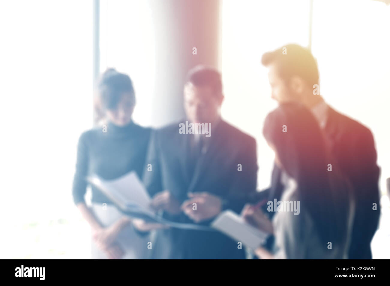 Blurred Business People In Office Interior With Space For