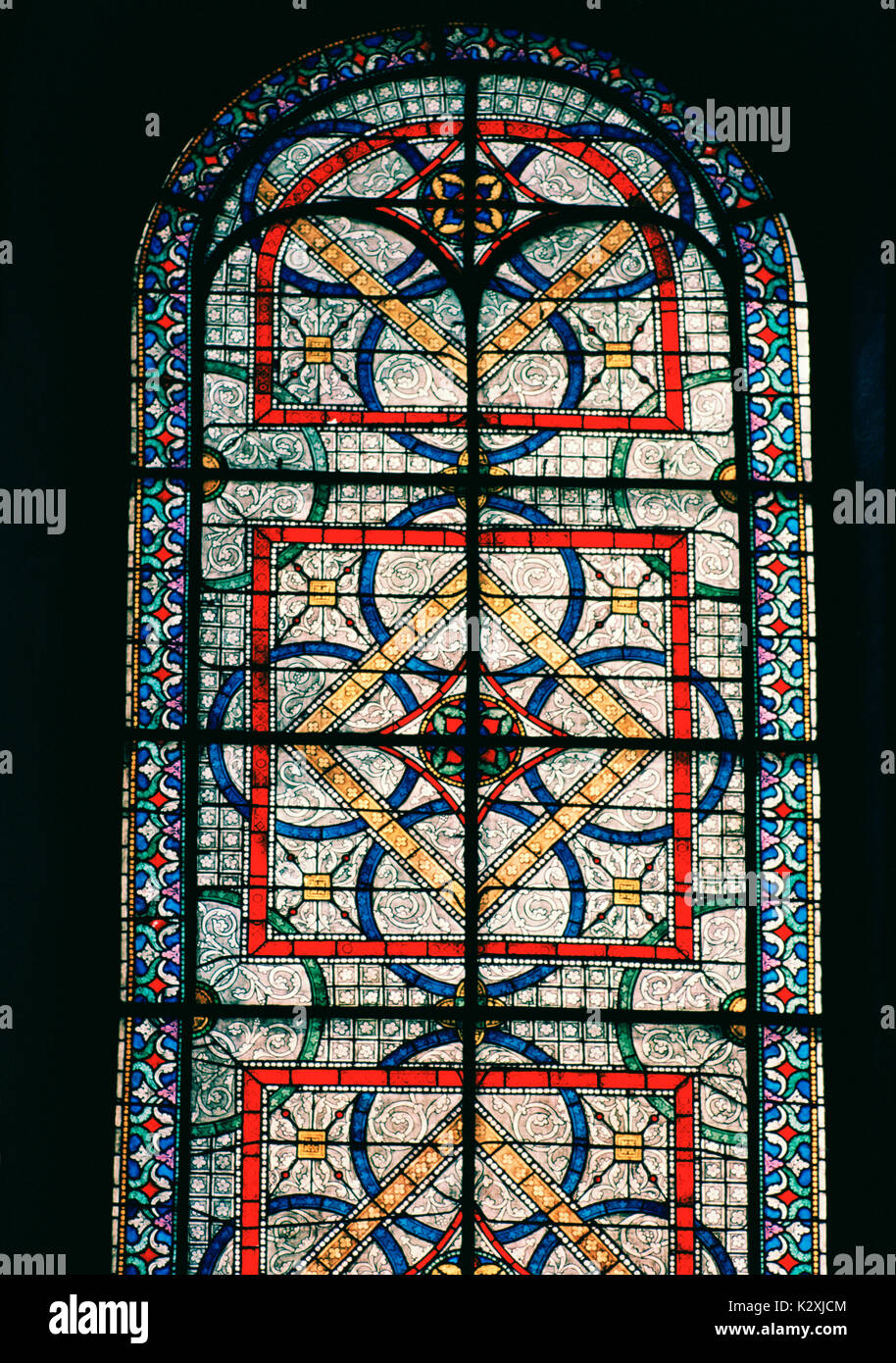 Stained glass window in Canterbury Cathedral in City of Canterbury in Kent in England in Great Britain in the United Kingdom UK Europe. Stained Glass Stock Photo
