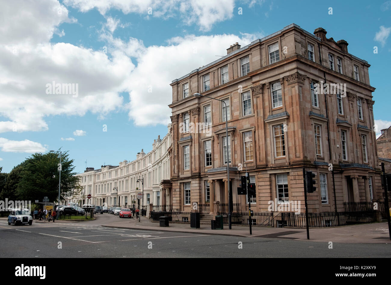 The architecture of the Royal Crescent terraced houses, just off Sauchiehall Street, Glasgow meets another fine mansion building Stock Photo