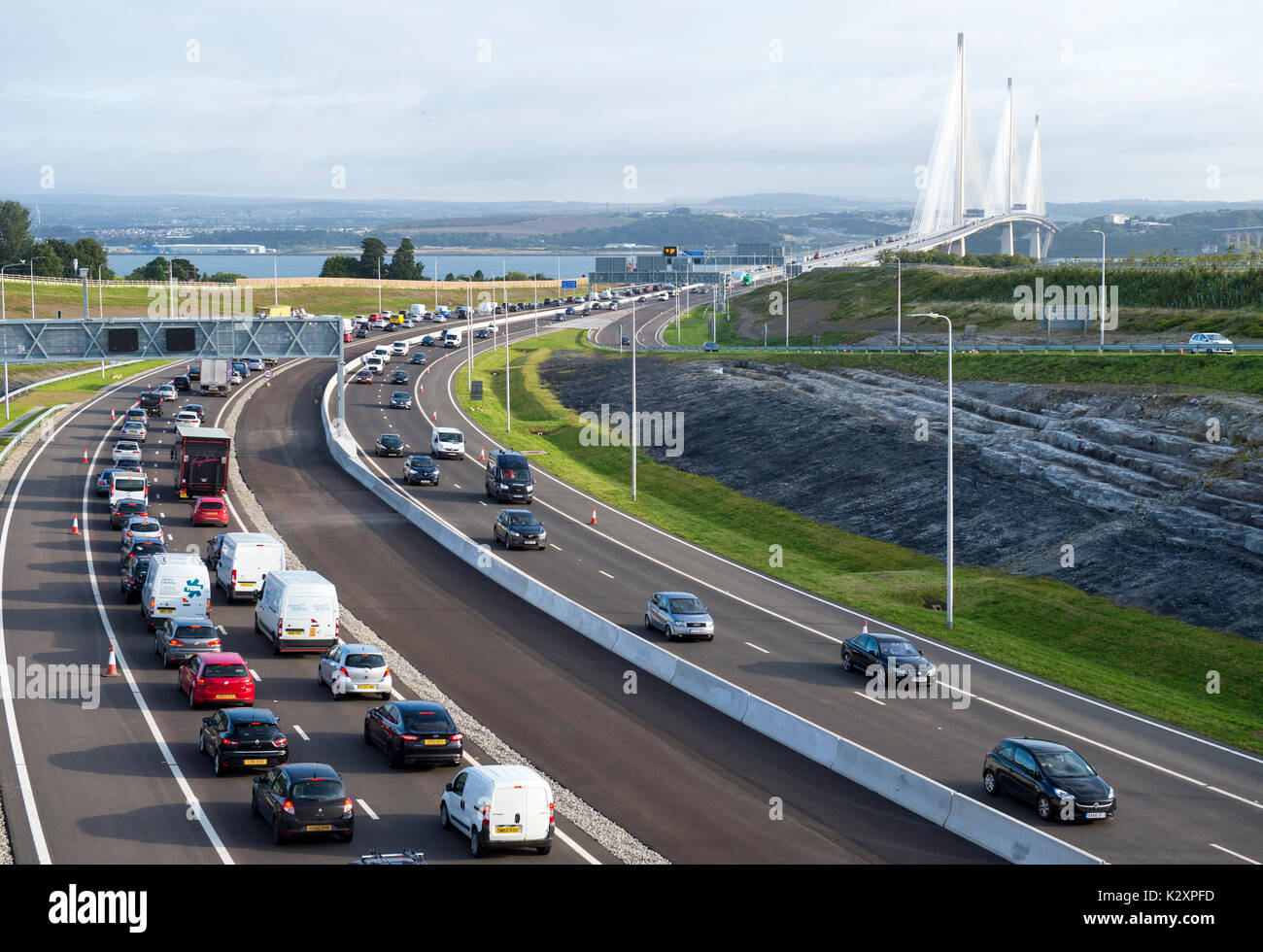A view looking north towards Fife showing traffic driving over the new Queensferry Crossing