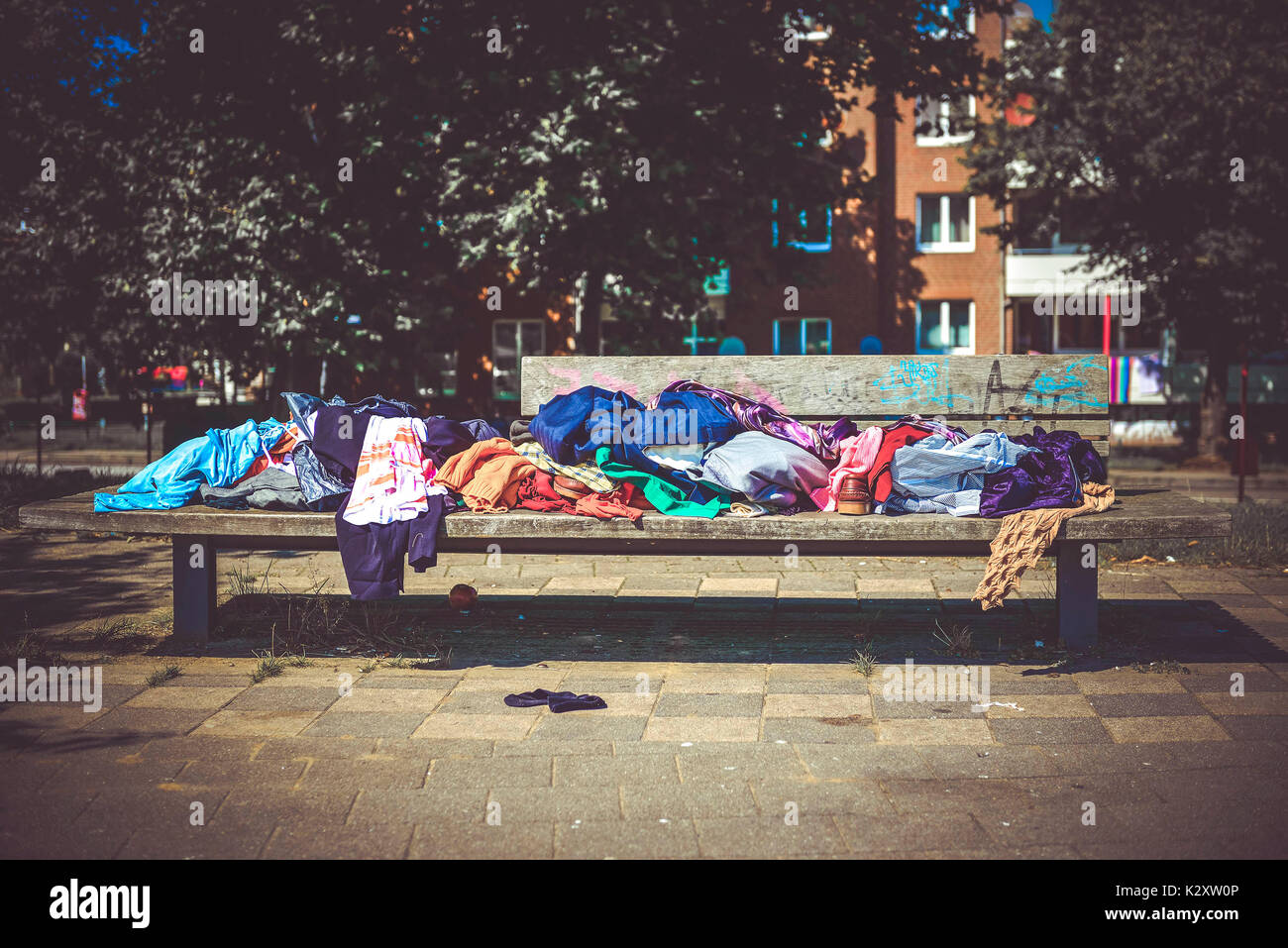 Bench with clothes in the Mueggenburger port of entry in Veddel, Hamburg, Germany, Europe, Sitzbank mit Kleidung am Mueggenburger Zollhafen in Veddel, Stock Photo