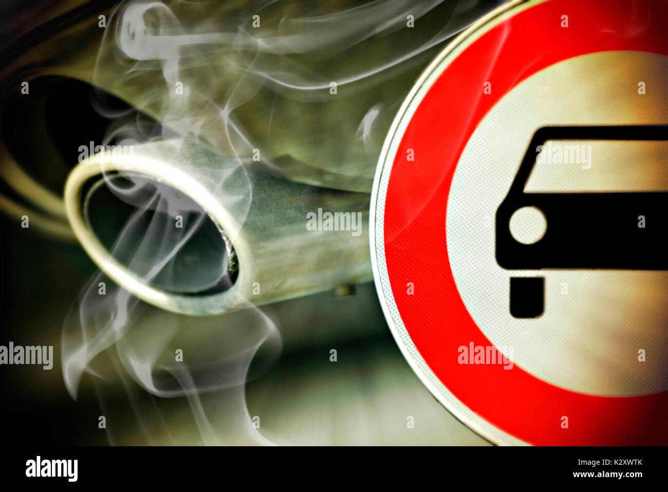 No parking sign and autoexhaust with exhaust gases, diesel ban on driving, Verbotsschild und Autoauspuff mit Abgasen, Diesel-Fahrverbot Stock Photo