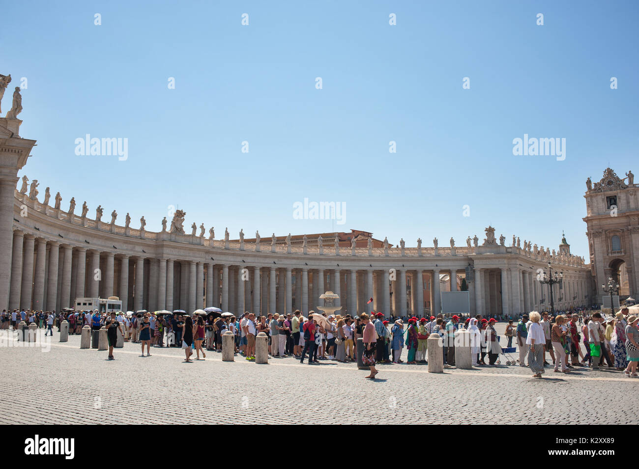 Rome, Italy, 2017 - Tourists standing in a line to enter St. Peter's church Stock Photo