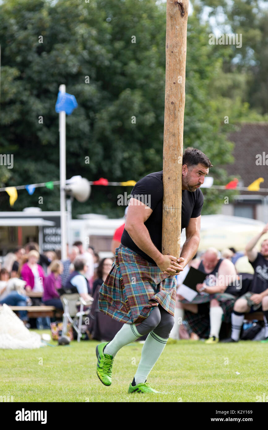 Ballater, Scotland Aug 10, 2017 A competitor in the caber toss, a